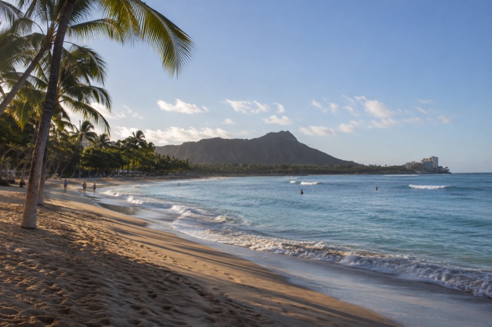 A view over Waikiki Beach toward Lēʻahi, the crater signposted as Diamond Head, on a clear morning