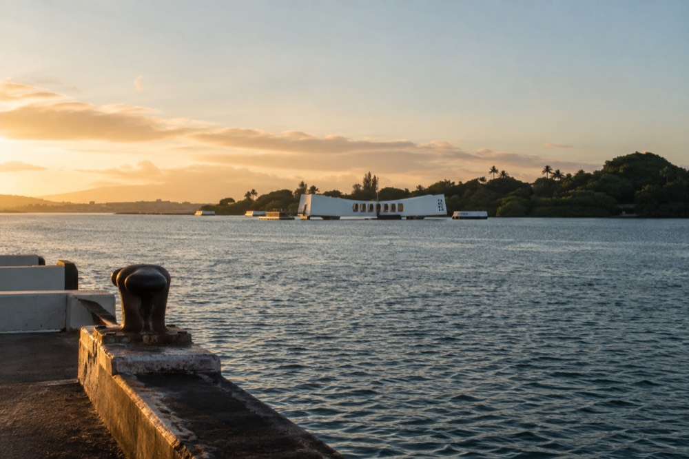 A quiet morning view over Pearl Harbor with the white memorial visible across the water