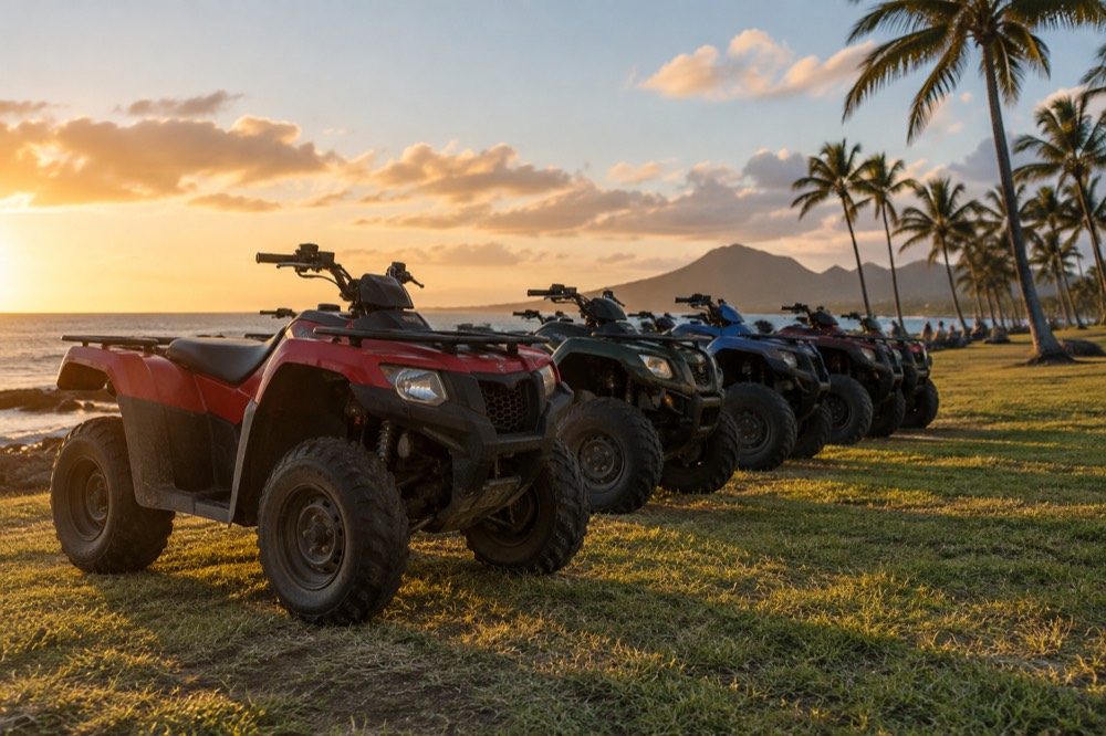 A group of all-terrain vehicles parked in a line on a grassy field near the Oahu coastline