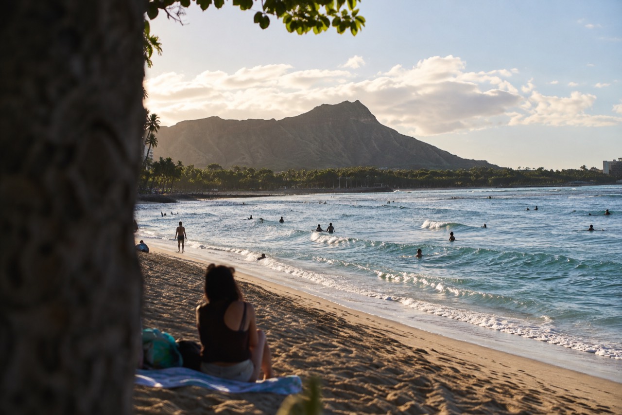 Golden light over the Waikiki coastline with Diamond Head in the distance